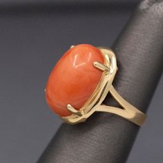 The color of this coral reminds us exactly of creamy tomato bisque! The ring features a natural, un-dyed oval cabochon of natural coral measuring approx. 18 x 13 x 7mm. The gorgeous stone is held with four prongs on a frame which extends just slightly past the stone. It has a split shank for balance. The ring is crafted in 14k (stamped 585) and weighs 5.62g. The ring is currently a small size 5 but casn easily be resized before shipment for a fee, please ask for a quote in your size. Creamy Tomato Bisque, Tomato Bisque, Natural Coral, Cabochon Ring, Split Shank, Oval Cabochon, Statement Ring, Statement Rings, Split