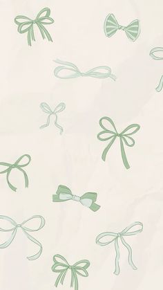 green bows and ribbons on white paper