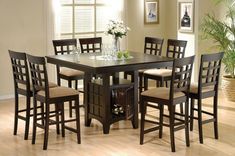 a dining room table with chairs around it