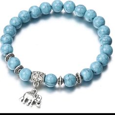 Very Pretty Bracelet W/ “ Elephant Charm” Representing “ Good Luck “ Turquoise Color ( Color Is A Bit Deeper Than Actual Pic ) Stretch Bracelet Boho Charm Bracelet, Making Bracelets With Beads, Blue Beaded Bracelets, Elephant Bracelet, Turquoise Bead Bracelet, Gold Armband, Beads Bracelet Design, Bracelets Diy, Classic Bracelets