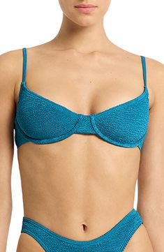 This balconette-inspired bikini top boasts a supportive underwire to keep you feeling confident as you lounge by the water. Slips on over head Adjustable straps 88% nylon, 12% elastane Hand wash, dry flat Made in Australia Summer Underwire Bra With Padded Cups, Summer Bra With Padded Underwire Cups, Underwire Swimwear With Padded Cups For Sunbathing, Beachwear Bra With Padded Cups For Sunbathing, Poolside Underwire Padded Bra, Vacation Underwire Bra With Padded Cups, Padded Underwire Swimwear For Beach Season, Nylon Underwire Swimwear For Sunbathing, Poolside Padded Underwire Swimwear