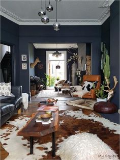 a living room filled with lots of furniture and decor