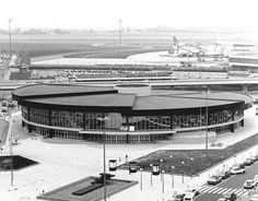 an airport with cars parked in front of it