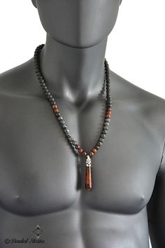 A stunning Mahogany Obsidian healing point pendant is featured as a focal point of this long beaded necklace for men made with 8 mm natural gemstone Mahogany Obsidian, Labradorite and Black Lava round beads. Sophisticated and masculine, this men's necklace is perfect for making a statement effortlessly and stylishly. This Shambala healing crystal necklace is perfect as a birthday, anniversary, Father's day, Valentine's day gift for husband, boyfriend, dad, son, brother, etc. The necklace is stru Beaded Necklace Designs For Men, Mens Bead Necklace Ideas, Buddhist Outfit, Mens Stone Necklace, Men's Beaded Necklace, Crystal Necklace Men, Men Beaded Necklace Ideas, Crystal Necklace For Men, Beaded Jewelry For Men