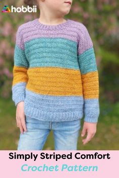 a young boy wearing a colorful striped sweater with the text simply striped comfort crochet pattern