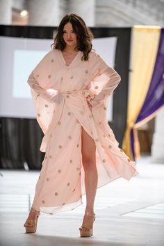 Beyond its role as a stunning bridal accessory, this Blush Pink Robe with Gold Zari Details seamlessly transitions into a versatile wardrobe essential. Picture yourself lounging in style on lazy Sunday mornings, sipping coffee and embracing the comfort of this luxurious robe. It becomes a statement piece for spa days at home, transforming ordinary self-care routines into moments of pure indulgence. Effortlessly elevate your loungewear game by pairing it with your favorite pajamas or silky loungi Pink Wedding Kaftan With Traditional Drape, Elegant V-neck Kimono For Wedding, Elegant V-neck Wedding Kimono, Festive V-neck Wedding Kaftan, Spring Wedding Kaftan With Traditional Drape, Long Bridesmaid Gown, Long Kimono For Bridesmaids, Floor-length Wedding Kaftan With Sheer Dupatta, Wedding Floor-length Kaftan With Sheer Dupatta