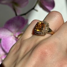 Vintage 14KT yellow gold halo style ring with cushion, checkerboard, faceted, genuine, warm citrine and diamond halo ring. Size 6.75 Can be resized for an additional fee Weight: 5.40 grams Genuine, cushion-cut citrine, faceted measures: 9mm 2.00 carat citrine Stamped 14K and ENA Diamonds: .15 carat Excellent estate condition Rope twist halo design Elegant Gold Cushion Cut Topaz Ring, Gold Cushion Cut Topaz Ring For Formal Occasions, Formal Gold Cushion Cut Topaz Ring, Formal Citrine Topaz Ring With Halo Setting, Luxury Citrine Rings With Halo Setting, Formal Citrine Cushion Cut Ring, Formal Cushion Cut Citrine Ring, Gold Square Cut Gemstone Diamond Ring, Gold Square Cut Diamond Ring With Gemstone