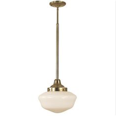 a light fixture with a white glass shade on the bottom and an antique brass finish