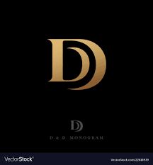 the letter d is made up of gold foil and black paper with a dark background