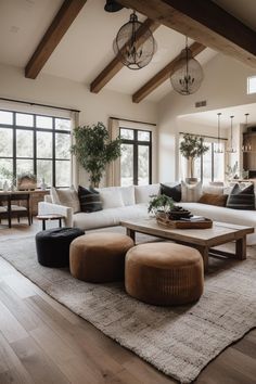 a living room filled with furniture and lots of windows