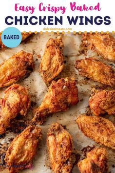 fried chicken wings on parchment paper with text overlay that says easy crispy baked chicken wings