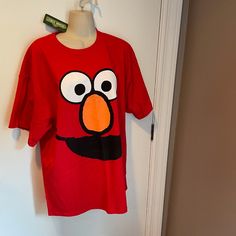 New With Tags Vintage 2009 Sesame Street Oversized Elmo T Shirt. Size Xl. Elmo's Face Is Huge On The Front And Will Surely Bring Smiles To Faces. Short Sleeve. Crew Neck. 100% Preshrunk Cotton. In Excellent Condition Since It Is Never Been Worn. Approximate Measurements: Armpit To Armpit = 22.5" And Length = 29" Elmo T Shirt, Cookie Monster Shirt, Cookie Monster T Shirt, Elmo Shirt, Cut Up Tees, Elmo Sesame Street, Womens Scrub Tops, Womens Scrubs, Tie Dye Shirt