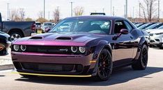 a purple and black car parked in a parking lot