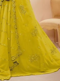 Introducing our adorable neon yellow sequins georgette wedding wear lehenga choli, a vibrant and stylish outfit that is perfect for any special occasion. This exquisite piece is made from high-quality georgette material in a stunning neon yellow color. It features intricate dori work, glitter sequin work, and embroidery work, adding a touch of elegance and glamour to the ensemble.
The set includes a matching georgette choli that is adorned with the same dori work, glitter sequin work, and embroi Dori Work, Georgette Material, Yellow Lehenga, Party Wear Lehenga Choli, Party Wear Lehenga, Designer Lehenga Choli, Green Sequins, Stylish Outfit, Sequins Embroidery