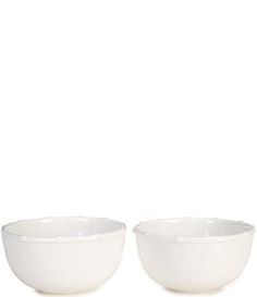 two white bowls sitting next to each other