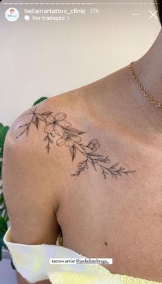 the back of a woman's shoulder with small flowers on her left arm and chest