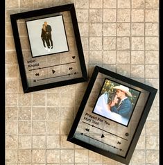 two black frames with pictures on them sitting next to each other in front of a tiled wall