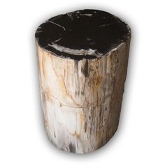 a wooden stump with black paint on it