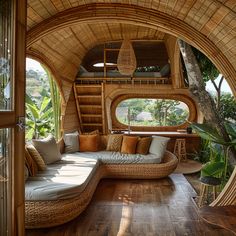 the inside of a living room with wooden floors and walls that are made out of bamboo