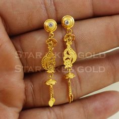 Elevate your style with these beautifully handcrafted gold earrings. Featuring a classic design and a comfortable fit, they add a refined touch to any look. Ideal for everyday wear or special occasions, they bring a subtle yet sophisticated sparkle. 18K Gold Dangle Earrings Metal is Real Gold Purity is 18kt Weight is 2.74 grams approx Max Length is 4.4 cm approx Max width is 0.7 cm approx ,  these earrings comes with normal backs, if you want real gold screw please contact. Please feel free to a Gold Dangle Earrings, Earrings Metal, Gold Earrings Dangle, Real Gold, Earrings Jewelry, Jewelry Earrings Dangle, Classic Design, Gold Earrings, Dangle Drop Earrings