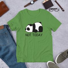 "Love pandas? Take a little bit of panda cuteness wherever you go with our comfy and adorable Not Today Panda unisex t-shirt. Great for either men or women. It feels soft and lightweight, with the right amount of stretch. Comes in ten great colors. Snatch one today! Also great as a gift for the panda lover in your life. Looking for a darker color? Check out our white pocket version! PRODUCT DETAILS * Fabric weight: 4.2 oz (142 g/m2) * Pre-shrunk fabric * Shoulder-to-shoulder taping * Side-seamed Cute Green T-shirt With Funny Text, Green T-shirt With Funny Print As Gift, Cute Funny Print T-shirt For Everyday, Cute T-shirt With Funny Text As Gift, Cute Funny Print T-shirt For Gift, Funny Panda, Panda Gifts, Kawaii Panda, Panda Tshirt