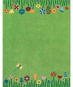 a green rug with flowers and birds on it