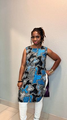 This is a beautiful Mix and Match African Print Tunic Top made with two different fabrics. Whether you opt to dress up or dress down, its perfect for any outing. Wear this with any regular pants or jeans. It is definitely a head turner for its elegance and bright colors. You're sure to stand out from the crowd on this top because it exudes confidence and class. This Top is already made and ready to wear. Size: US S/M Model typically wears a Medium and is 5ft tall. Available as a custom order. Just send a message to discuss further details. We will do all we can to ensure you love your top and promptly address any additional requests or issues you may have. If you'll like a custom outfit made just for you, just go ahead and start a conversation by clicking on the 'contact seller' button. Th Sleeveless Cotton Dress With Batik Print, Blue Batik Print Sleeveless Dress, Blue Sleeveless Batik Print Dress, Blue Sleeveless Dress With Batik Print, Multicolor Fitted Tunic Dress, Blue Mixed Print Dress, Fitted Sleeveless Batik Print Dress, Blue Fitted Tunic, Multicolor Fitted Dresses With Mixed Print