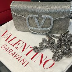 Valentino Loc Embroidered Small Shoulder Bag Like New- Used Once For An Event. Comes With Strap, Box And Duster Description Valentino Garavani Loc Small Shoulder Bag Embroidered With Leather Trim And With Vlogo Signature Element Covered In Swarovski Crystals. Equipped With Both A Detachable Sliding Chain Strap And A Detachable Handle, This Accessory Can Be Worn As A Crossbody/Shoulder Bag Or Used As A Handbag. - Palladium-Finish Hardware - Magnetic Closure - Removable Leather Handle - Shoulder S Valentino Garavani Bag, Embroidered Bag, Small Shoulder Bag, Nappa Leather, Leather Trim, Magnetic Closure, Leather Handle, Crossbody Shoulder Bag, Chain Strap