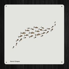 a flock of fish swimming across a white surface in front of a black frame with the words stencil shapes on it