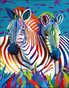 two colorful zebras standing next to each other in front of blue sky and green grass