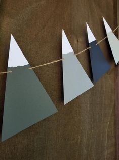 some paper triangles are hanging on a string