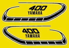 two stickers with the words yamaha on them and an image of a motorcycle track