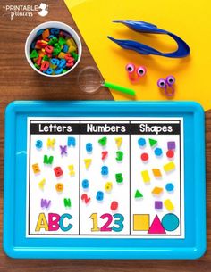 a blue tray with letters, numbers and shapes on it