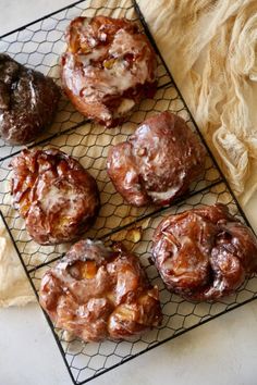 several pastries are sitting on a cooling rack