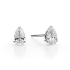 Perfect your everyday look with the timeless sparkle of these dainty pear-shaped diamond solitaire stud earrings in white gold. Crafted in 14K white gold Each earring showcases a 1/10 ct. pear-shaped diamond solitaire. Great for layering and stacking with other earring styles Shimmering with 1/5 ct. t.w. of diamonds These post earrings secure comfortably with friction backs. Fine Jewelry White Gold Pear Diamond Earrings, Fine Jewelry Pear Shaped White Gold Diamond Earrings, Pear-shaped White Gold Diamond Earrings, Classic Pear-shaped White Gold Diamond Earrings, Pear Shaped White Gold Diamond Cut Earrings, White Brilliant Cut Pear Shaped Diamond Earrings, Classic White Gold Teardrop Diamond Earrings, Classic Pear Shaped Diamond Earrings, Classic Pear Shaped Diamond Earrings For Anniversary