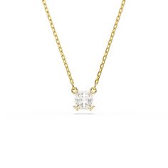 The timeless elegance of our iconic Stilla family shines through in this beautiful pendant. The gold-tone plated design features a square-cut Swarovski Zirconia in a refined double prong setting, while its elongated chain is completed with a lobster closure. This multifaceted piece would make a mesmerizing gift for a special occasion. Collection: Stilla Length (minimum - maximum): 14 7/8 to 17 3/4 inch Motif size: 1/4 x 3/8 inch Material: Gold-tone plated, Zirconia Color: White Clasp type: Lobst Plate Necklace, Swarovski Jewelry, Square Cut, Personalized Accessories, Swarovski Crystal, Prong Setting, Timeless Elegance, Swarovski Crystals, Gold Tones