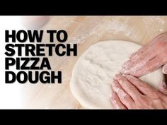 a person kneading dough on top of a wooden table with the words how to stretch pizza dough