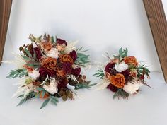 two bridal bouquets sitting next to each other