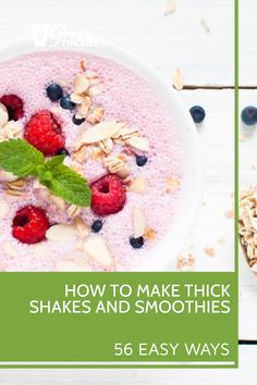 a bowl of oatmeal with berries, almonds and mint on top