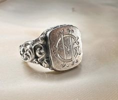 Massive 1920s antique silver German signet ring, with initials 'CH' or 'HC' engraved, marked '900' for silver, the ring is in good condition. Box on the photos not included! Material: 900 silver  Weight: 11.8 g US size: 10 1/2 (EU 63 1/2) Box on photos is NOT included! Victorian Engraved Rings For Memorial, Vintage Engraved Signet Ring For Memorial, Vintage Hallmarked Rings For Memorial, Antique Engraved Ring For Memorial, Victorian Engraved Memorial Rings, Vintage White Gold Sterling Silver Signet Ring, Antique Signet Ring With Maker's Mark, Antique Hallmarked White Gold Signet Ring, Vintage Silver Signet Ring With Engraving Option