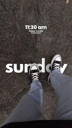 the feet of a person standing in front of a sign that says sunday