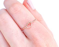 Rose Gold Infinity Knot ring Rose Gold-fill ring rose gold | Etsy Dainty Infinity Midi Rings For Gift, Dainty Infinity Midi Rings As Gift, Adjustable Simple Rose Gold Midi Rings, Simple Adjustable Rose Gold Midi Rings, Simple Rose Gold Midi Rings As Gift, Dainty Infinity Stackable Rings For Gift, Dainty Infinity Stackable Rings As Gift, Infinity Knot Ring, Love Promise