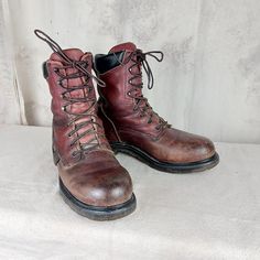 Nice pair of Red Wing work bootsunion made in the United States. Reddish brown leather uppers and synthetic soles. Eight rows of laces holes and hooks. Nice padded leather piece at the top of the boots for comfort. Condition is good. Some bumps and bruises and a bit of staining but rock solid. Laces are good.  Men's size 9 B (narrow width) Rustic Lace-up Leather Work Boots, Leather Work Boots For Outdoor With Closed Toe, Leather Closed Toe Work Boots For Outdoor, Leather Work Boots For Outdoor, Lace-up Leather Work Boots For Outdoor, Brown Steel Toe Rugged Combat Boots, Rugged Brown Combat Boots With Steel Toe, Brown Rugged Combat Boots With Steel Toe, Rugged Sturdy Leather Boots