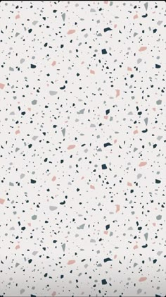 a white background with black, pink and grey speckles