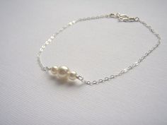 Sterling Silver Bracelet- Pearl Bracelet- White Pearl- Dainty Silver Bracelet- Tiny Pearl Jewelry- 925 Sterling Bracelet. $13.00, via Etsy. Sterling Silver Round Charm Bracelet For Wedding, White Sterling Silver Bracelets For Bridesmaids, Dainty Silver Charm Bracelet For Bridesmaid Gift, White Sterling Silver Bracelet For Bridesmaid Gift, Dainty Hypoallergenic Charm Bracelet For Weddings, Hypoallergenic Sterling Silver Bracelets For Bridesmaids, White Gold Charm Bracelet For Wedding, Dainty Silver Charm Bracelet For Wedding, Minimalist Sterling Silver Pearl Bracelet For Wedding