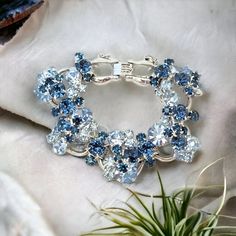 "This is a gorgeous Juliana 5 link silver tone bracelet.  It has dark and light blue chaton rhinestones with a wire over construction.  There is a fold-over clasp with a safety chain.  Please note that two of the stones have small chips as pictured. This is #6522 in the \"Is It Juliana Jewelry\" database." Blue Crystal Bracelets For Formal Occasions, Blue Crystal Bracelets For Anniversary, Elegant Blue Crystal Bracelet With Sparkling Stones, Blue Crystal Bracelet For Formal Occasions, Blue Crystal Bracelet For Party, Blue Crystal Bracelets For Wedding, Blue Crystal Bracelet With Sparkling Stones, Party Blue Crystal Bracelets, Blue Sparkling Crystal Jewelry