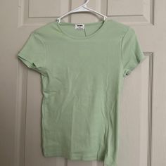 Brand New Never Worn Cotton On Light Green Short Sleeve Shirt. Size Small. Color Light Green. Plain Green T-shirt For Spring, Green Plain Tops For Spring, Spring Fitted Basic Shirt, Basic Fitted Shirt For Spring, Fitted Basic Shirt For Spring, Basic Crew Neck Shirt For Spring, Basic Stretch Shirt For Spring, Green Short Sleeve Shirt, Light Green Shirt