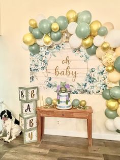 a baby's first birthday party with balloons and decorations