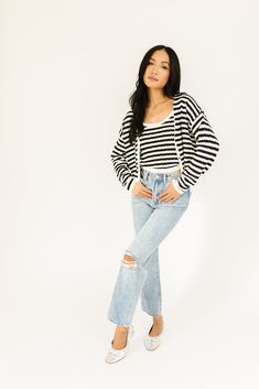 it’s a tank, it’s a cardigan – it’s a tank + cardigan combo. detailed with a retro-inspired black + white stripe pattern, this cropped sweater tank + cardigan set is a spring outfit staple. wear them together or separately to elevate any outfit. black + white // two piece set, scoop neckline, buttons, drop shoulder paired with our sicily distressed denim model is 5'8" + wearing a small measurements are approximate + taken while laying flat small : bust 44” length 18.5” tank: small : bust 28” len Chic Knit Cropped Sweater For Spring, Chic Cropped Sweater For Spring Day Out, Casual Cropped Sweater For Spring Layering, Chic Striped Cropped Crop Top, Chic Striped Cropped Top, Trendy Cropped Summer Cardigan, Casual Cropped Sweater For Day Out, Trendy Striped Cropped Sweater For Spring, Chic Striped Cardigan For Spring