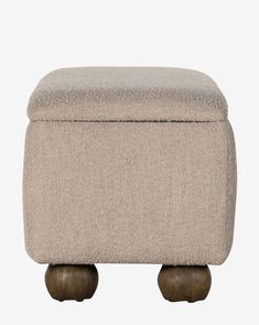 the footstool is made out of wood and fabric